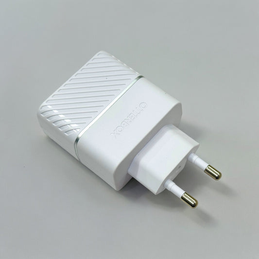 A white USB-C wall charger with a EU plug on a grey background.