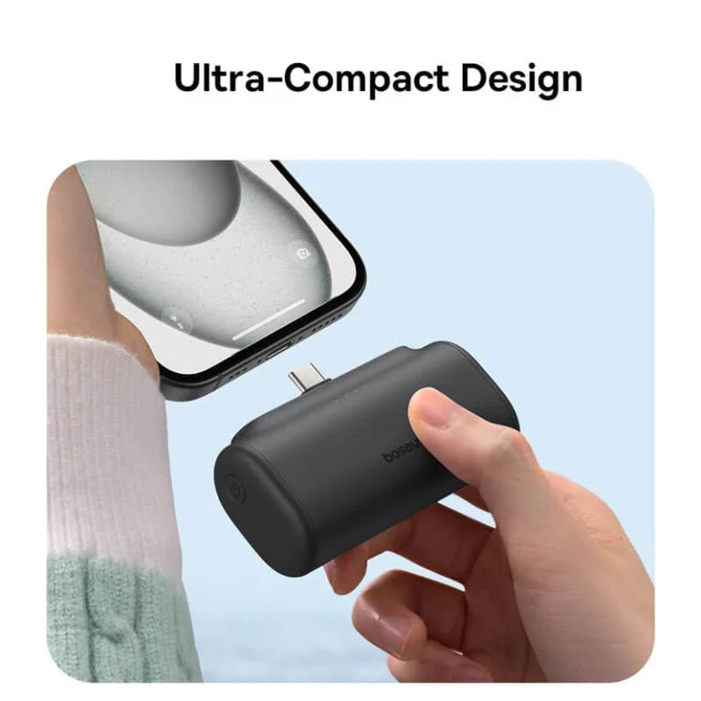 Baseus ultra-compact design product being held by a hand with a phone in the background