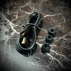 Electrical cord with plugs and connectors on a marble surface