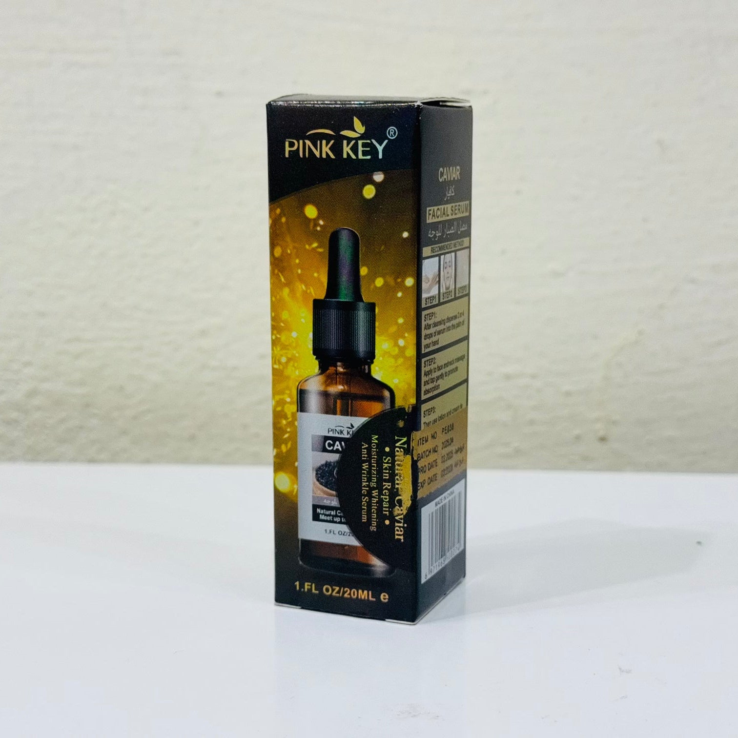 Pink Key CBD oil bottle packaging on a white surface with a light gray background