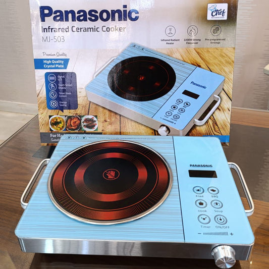 Panasonic infrared ceramic cooker on a wooden surface with packaging in the background