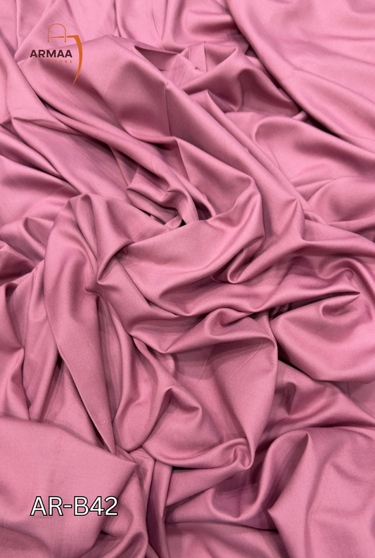 Pink fabric with a visible brand logo in the corner