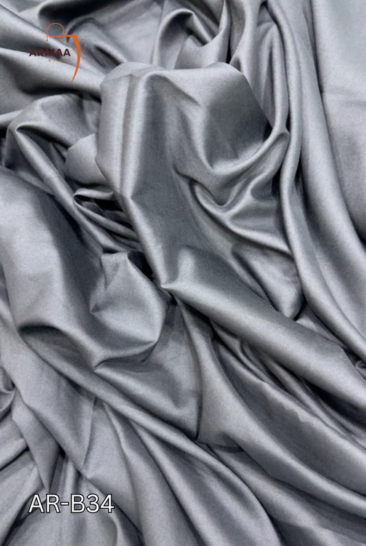 Gray fabric with a visible brand logo in the corner