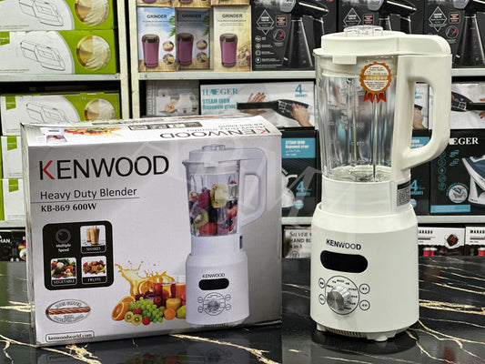 Kenwood heavy duty blender displayed alongside its packaging box. The blender is white with a clear jug and a control panel with big buttons.