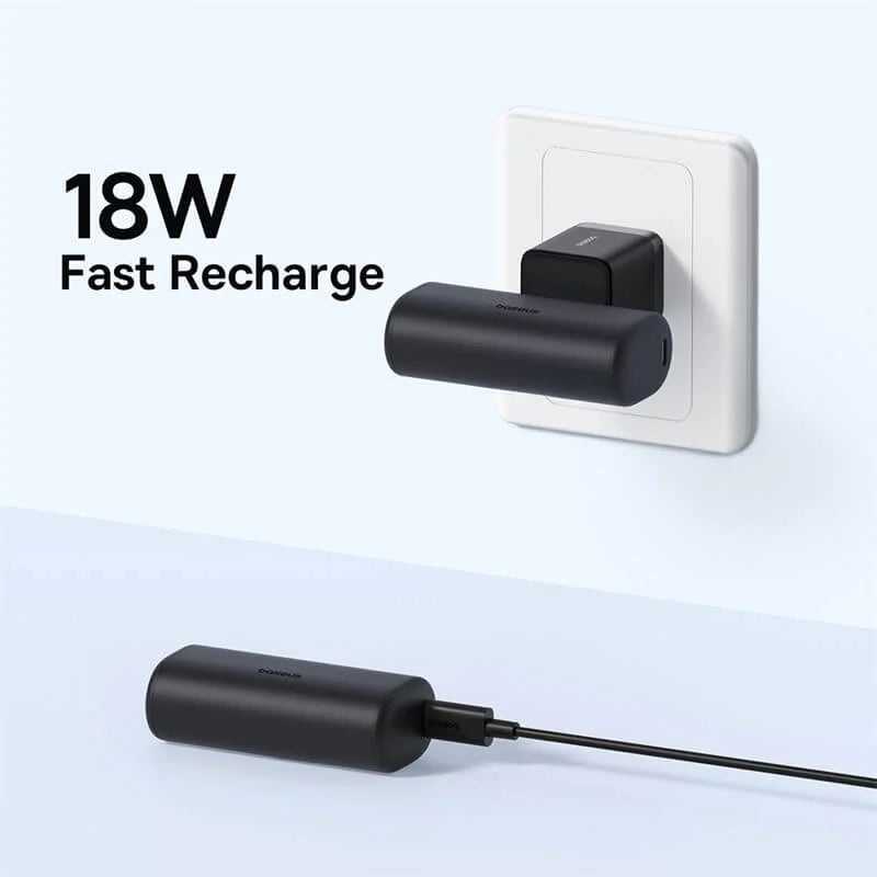 Baseus 18W fast charging device attached to a wall socket with clear background