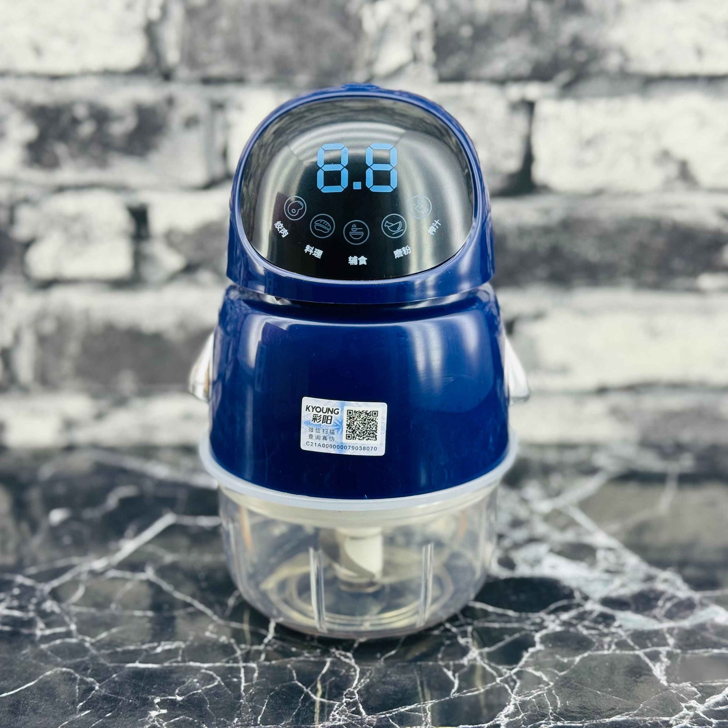 Blue electronic device with digital display on a marble surface