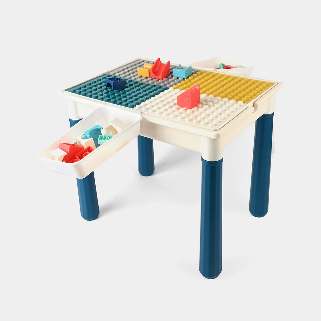 Children's play table with colorful building block surface and toy boats