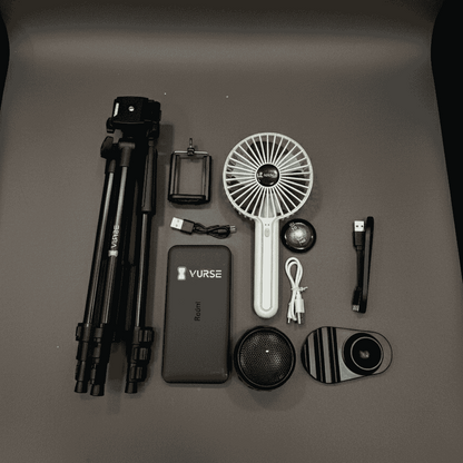 Collection of electronic devices and accessories on a dark surface