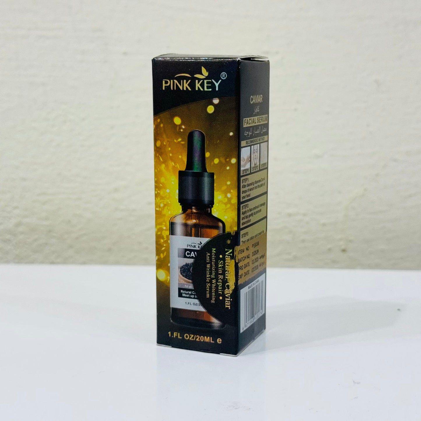 Pink Key CBD oil bottle packaging on a white surface with a light gray background