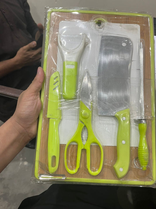 Set of kitchen utensils including a cleaver, knife, scissors, and others in a clear plastic packaging.