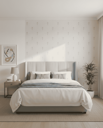 Modern bedroom with a bed, nightstand, lamp, and decorative elements.