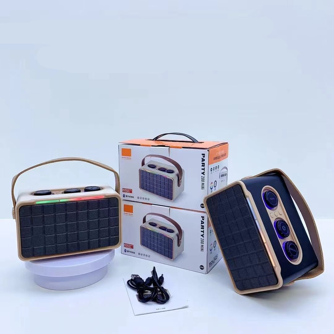 Portable speaker with packaging and accessories on a white background