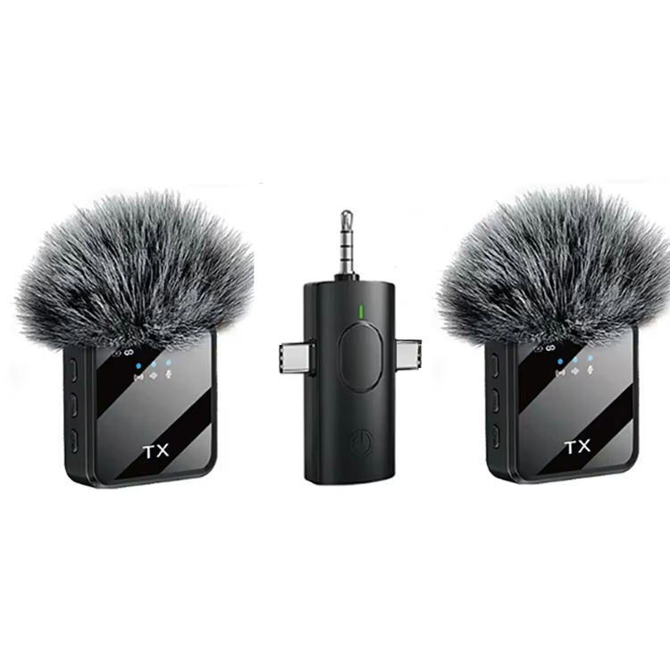 Two wireless microphone transmitters with windshields on a white background