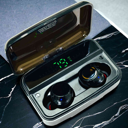 Wireless earbuds in a charging case on a marble surface