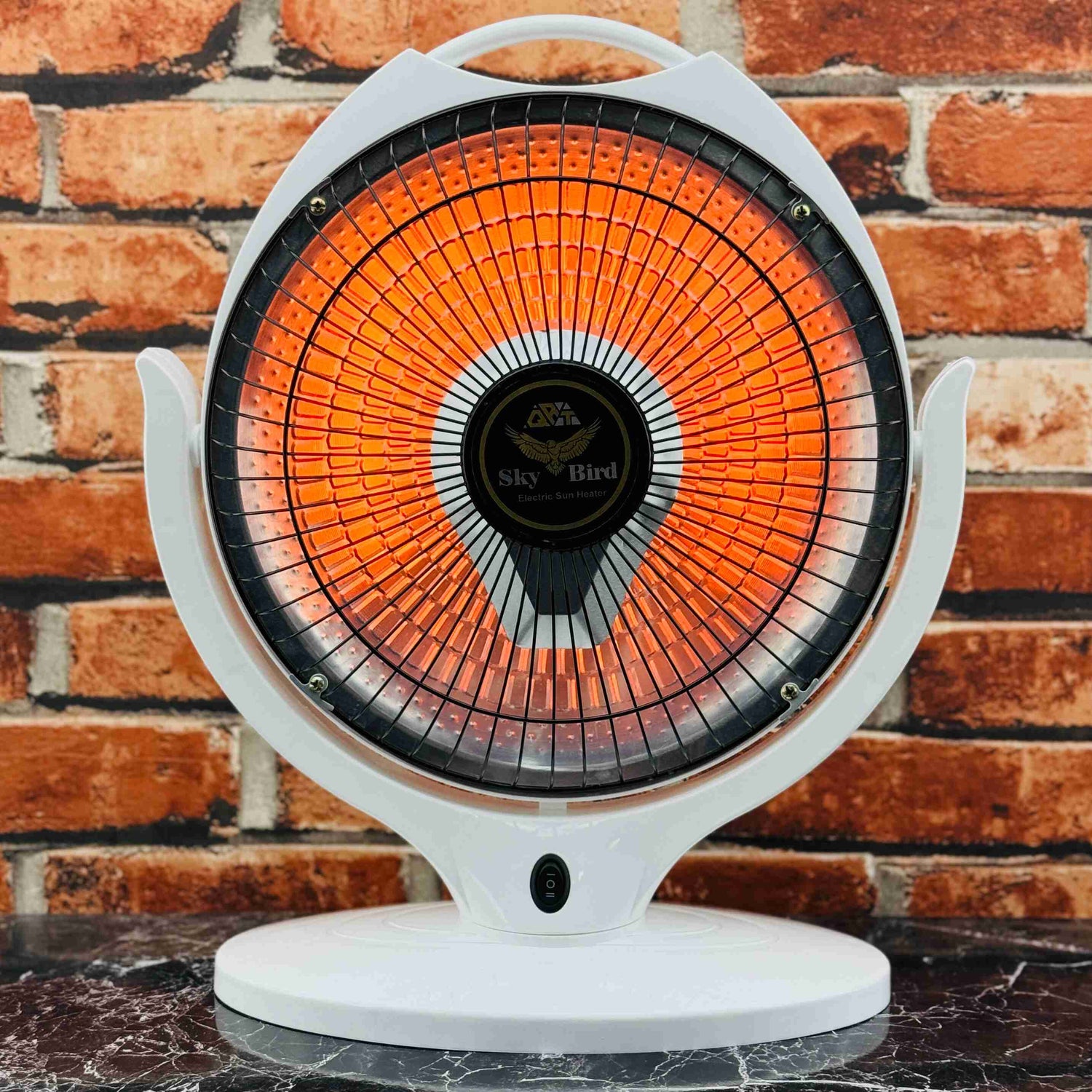 Portable electric heater with a white base and orange heating element against a brick wall background.
