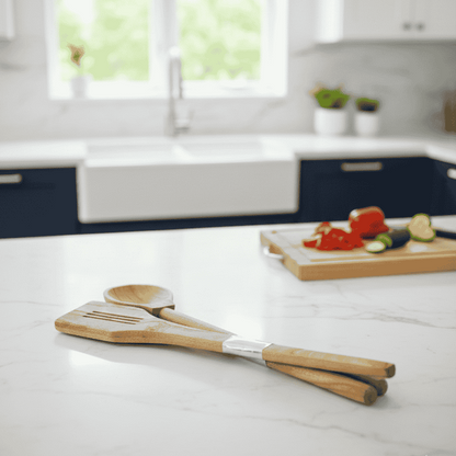 Kitchen counter with wooden utensils and a cutting board with vegetables in a bright kitchen.