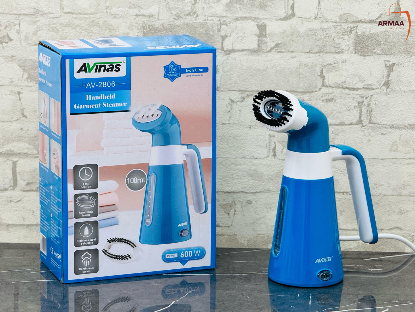 A blue Avinas handheld garment steamer next to its packaging box.