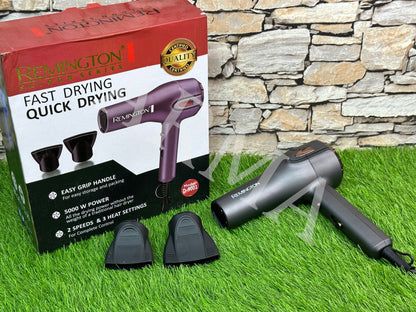 A Remington hair dryer and its accessories are displayed in front of the product packaging box, which has the brand and product model visible.