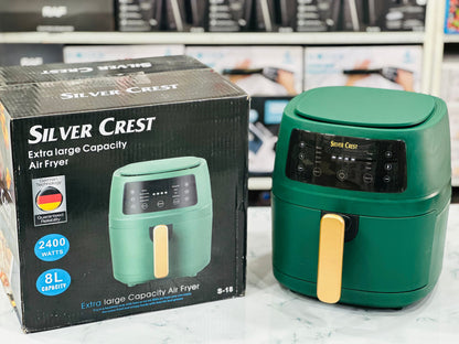 Silver Crest Digital Air Fryer in green color with a 8L capacity, displayed alongside its packaging box.