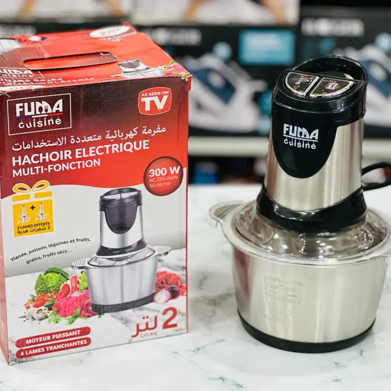 Packaging and product image of Fuma Cuisine 2L stainless steel chopper/meat grinder. The packaging shows the product and mentions 'Hachénction' and 450W, while the product image shows the chopper with a black and silver color scheme.